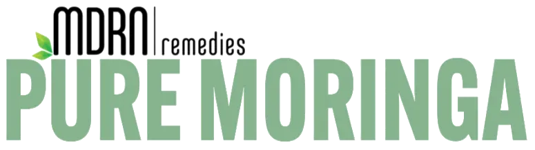 Open bottle of Pure Moringa capsules with powder spilling out